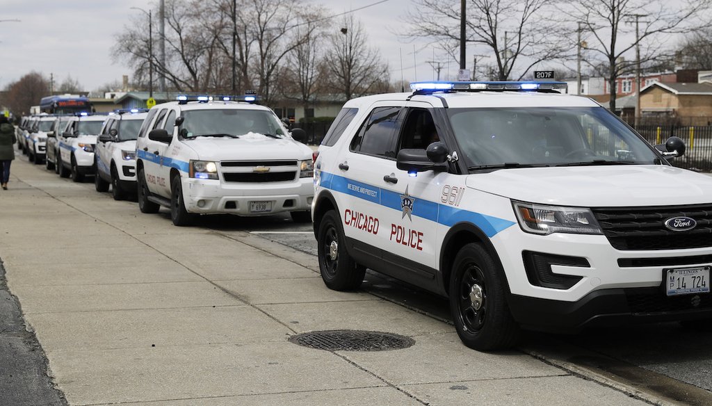 Chicago Police vehicles wait to receive Vital PPE from World Vision in Chicago, April 15, 2020. (AP)